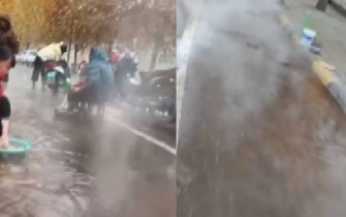 河南一村庄街上流出温泉水：市民拿着小板凳、脚盆坐在路边泡脚洗衣服 ！